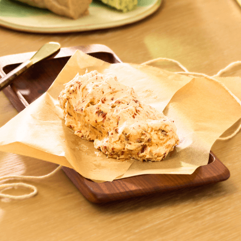Freshly-made Compound butter recipe sitting on brown tray