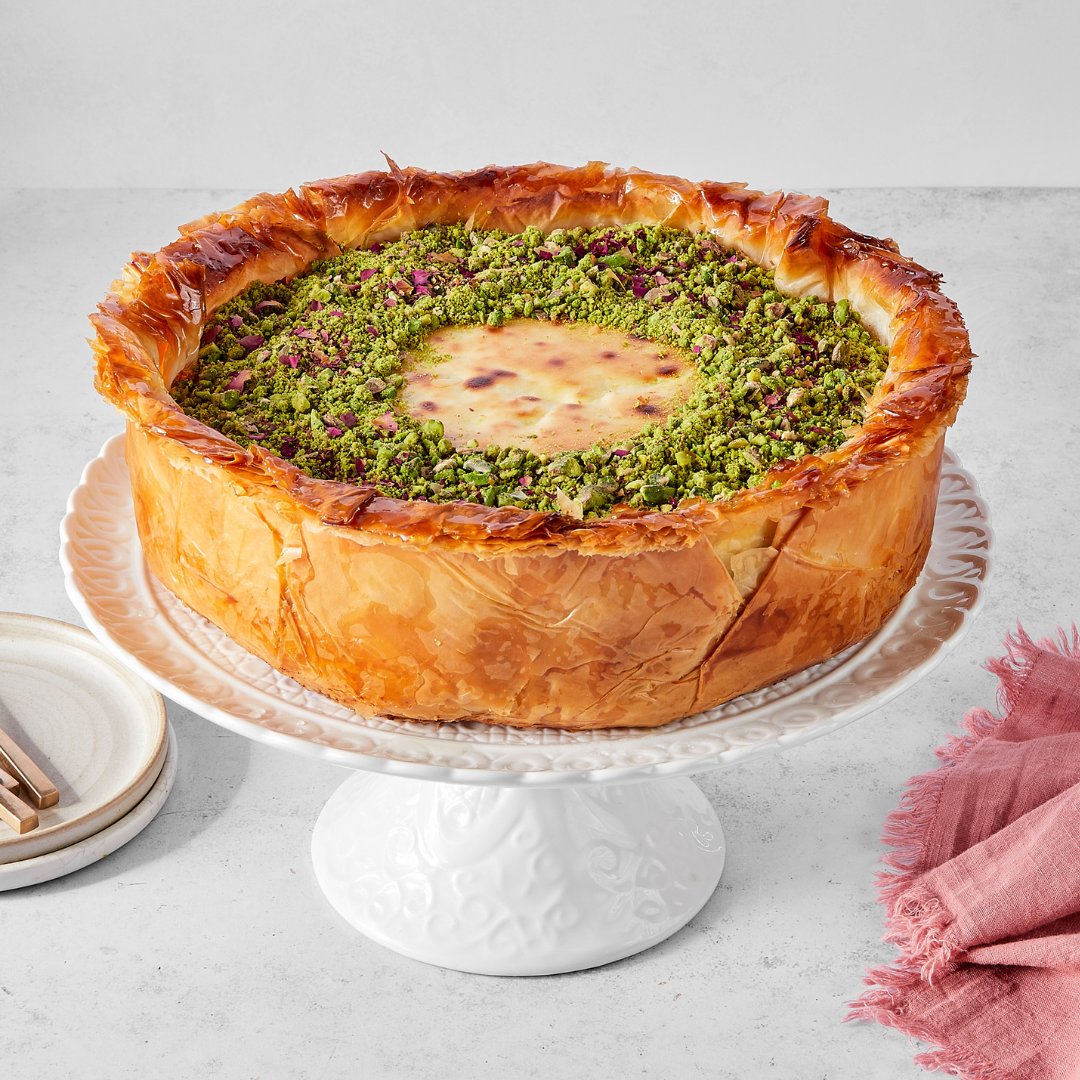 Recipe for a Baklava Cheesecake baked in a phyllo crust and topped with crushed pistachios