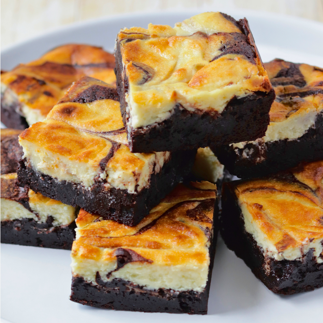 A stack of goat cheesecake brownies with a rich chocolate base and creamy cheesecake filling, The Goat Cheese Brownies with a creamy swirl
