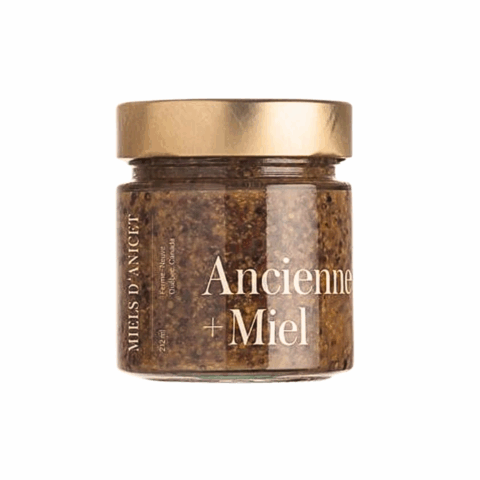 A clear jar of old-style mustard from Miels d’Anicet.