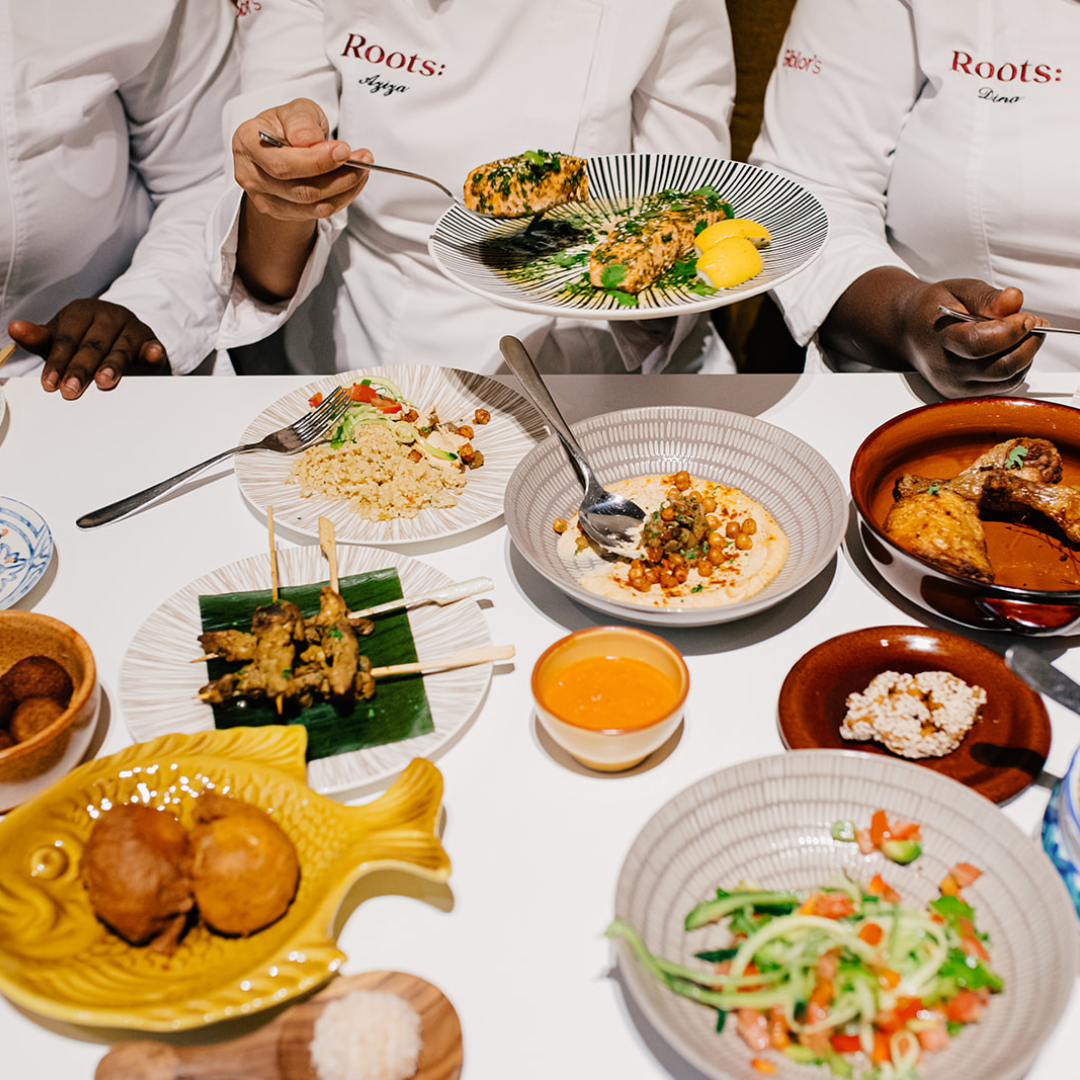 A table spread with colourful plates and dishes.