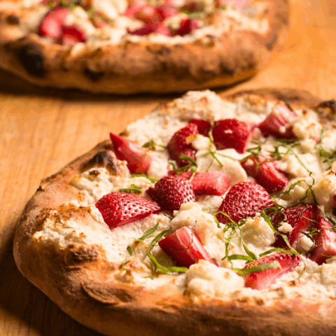 A strawberry goat cheese pizza hot right out of the oven.