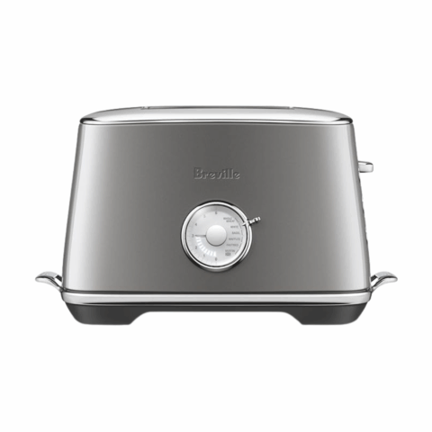 A silver toaster with a large white center dial.