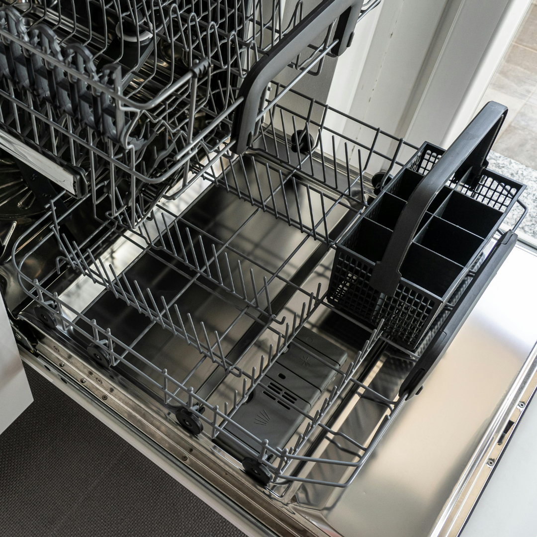 Close-up of an empty dishwasher.