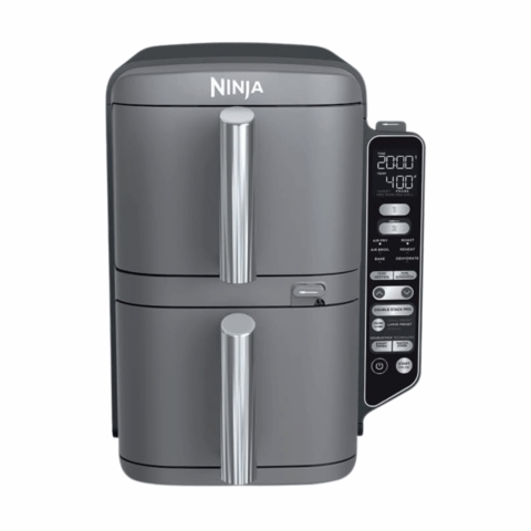 A gray air fryer with two baskets.