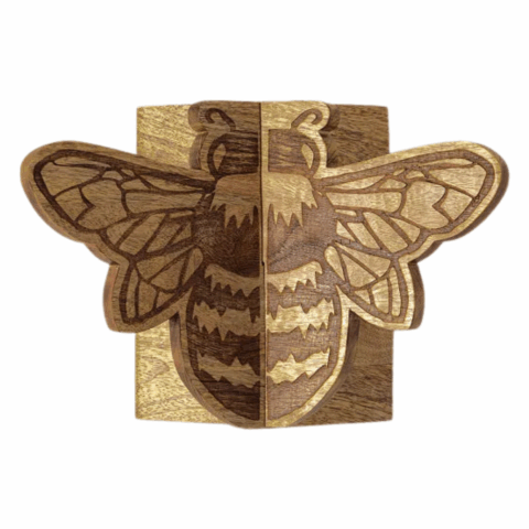 Top view of a wooden cookbook stand in the shape of a bee.