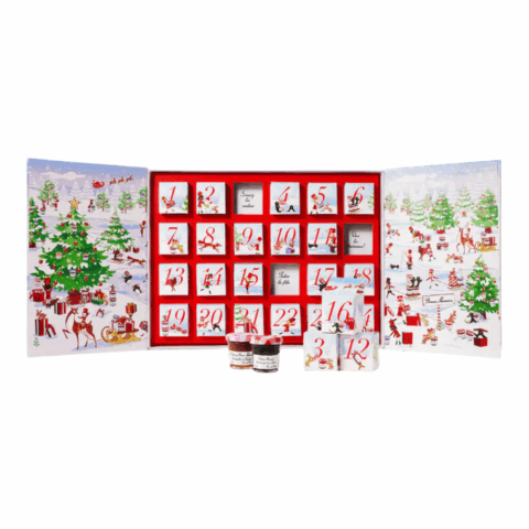 Open advent calendar featuring 24 small compartments filled with a mini jar of jam.