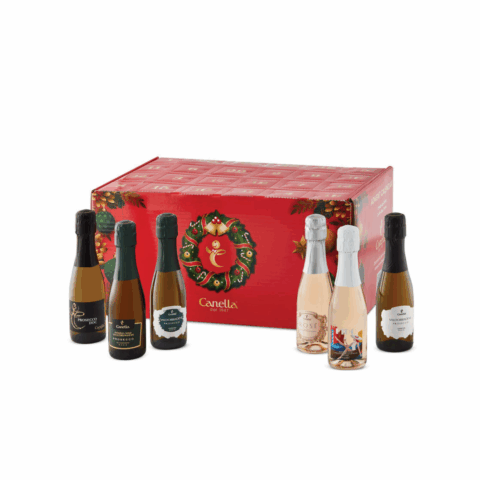Six mini bottles of prosecco in front of a red advent calendar.