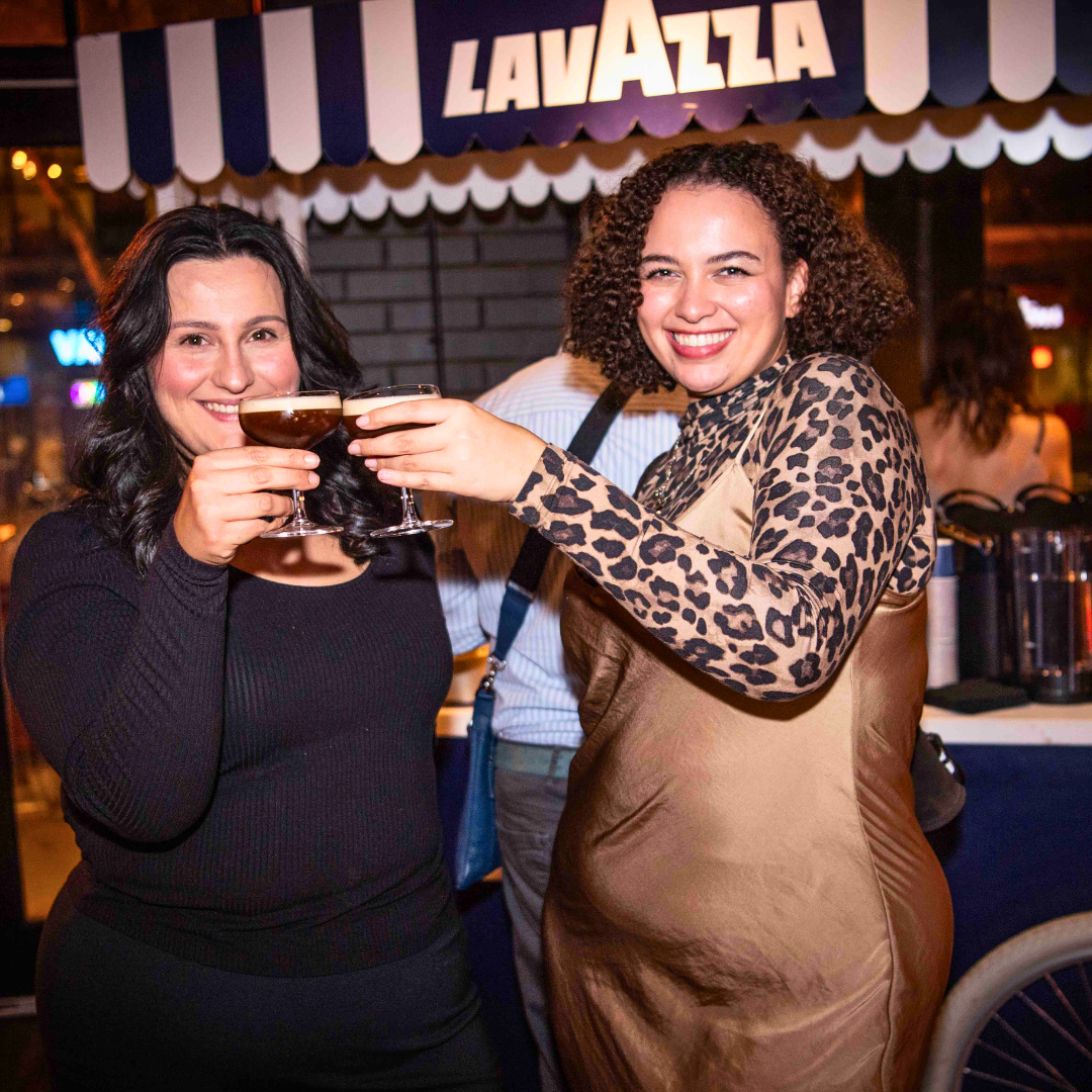 Two woman enjoying espresso martinis at a party