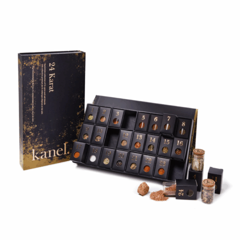 A black advent calendar with 24 mini jars of salts and spices.