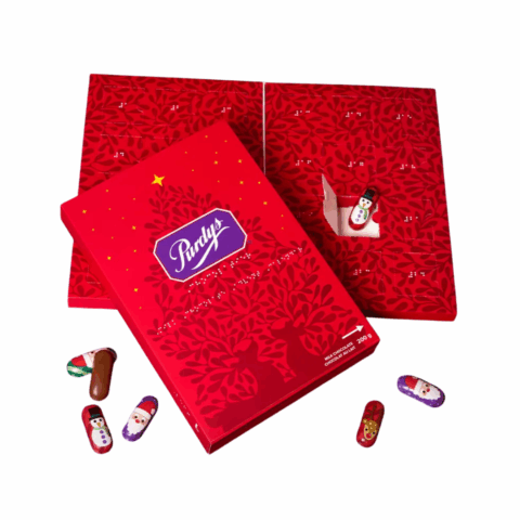 Two red advent calendars with braille lettering and small pieces of chocolate in festive wrappers.