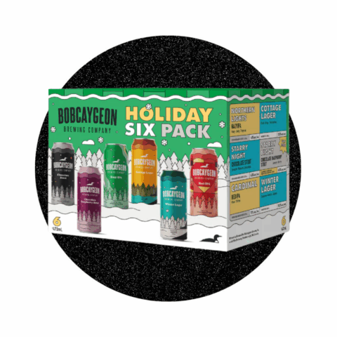 A green box displaying six different colourful cans of craft beer on the front.