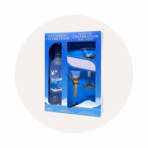 A set with a bottle of Grey Goose vodka and two martini glasses in blue packaging.