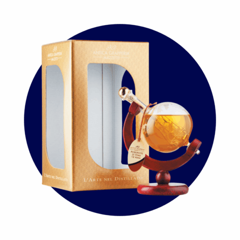 A bottle of brandy shaped like a globe on a wooden stand, next to a brown box.