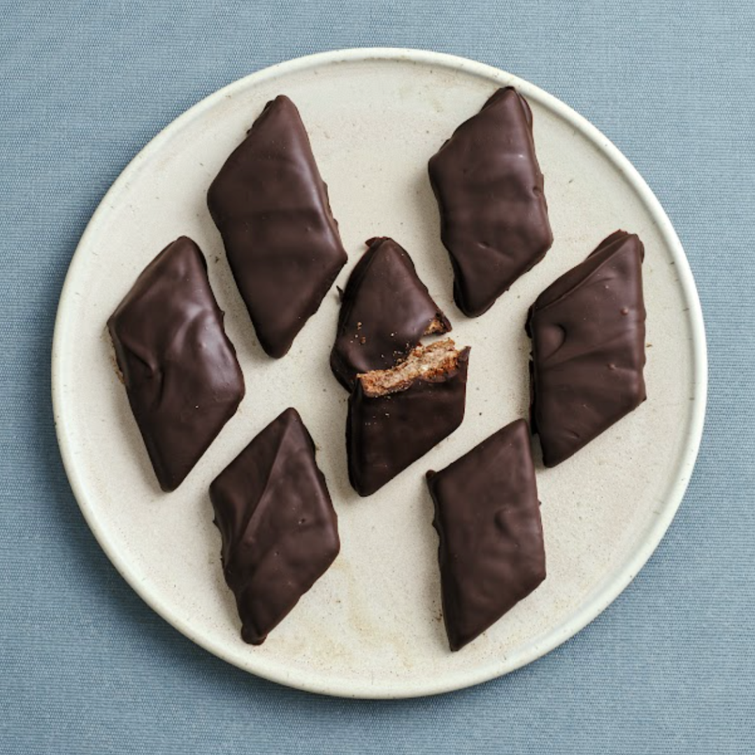 Mostaccioli Napoletani Italian Christmas cookies chocolate gingerbread style cookies on a plate