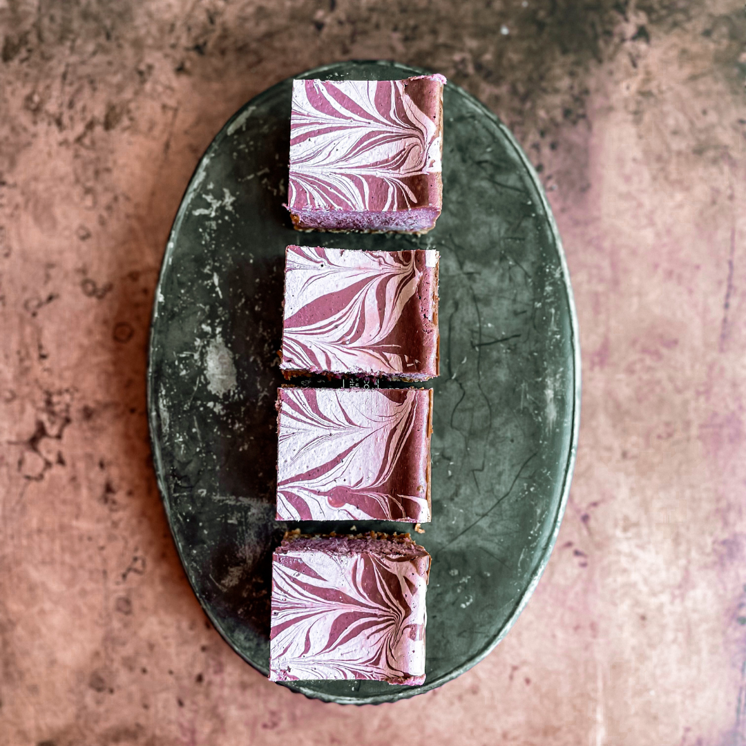 Ube Cheesecake bars shot overhead to show off the pretty pattern